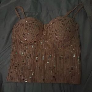 peach sequined shirt. shirt says “Large” but it runs a xsmall-small.